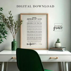 May include: A framed print with the text "Armor of God" and other religious text. The print is in a light wood frame and sits on a white desk with a green chair. The words "Digital Download" are at the top.