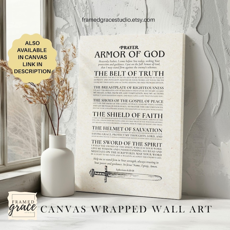 May include: Canvas wrapped wall art featuring the "Armor of God" prayer, with text in black on a cream background. The artwork includes a sword illustration and is displayed near a white vase with dried plants. The Etsy shop name is visible.