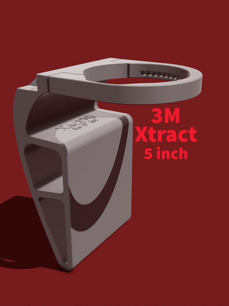 May include: A gray 3M Xtract 5 inch cup holder. The holder is made of plastic and has a textured surface. It is designed to hold a cup or bottle.