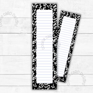 May include: Two black and white notebook paper bookmark designs with blue lines. The bookmarks are on a white wood background.