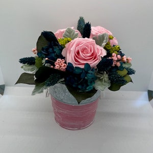 dried flower arrangement, 3 forever roses, preserved dried flowers.  The roses have been preserved.  They will last many years.