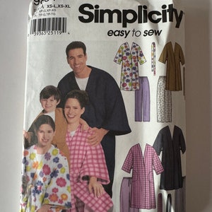 May include: Simplicity sewing pattern number 9834, easy to sew, for sizes XS-L, XS-XL, with instructions for making robes and pants. The pattern includes three different styles of robes, one with a floral print, one with a plaid print, and one with a solid color. The pattern also includes two different styles of pants, one with a floral print and one with a plaid print.