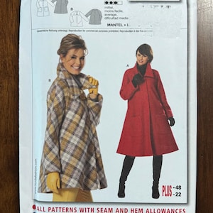 May include: A Burda 7587 sewing pattern envelope featuring two coat styles. Style A is a solid red coat with a high collar and patch pockets. Style B is a plaid coat in shades of brown, white, and gray with a wide collar. Includes size information.