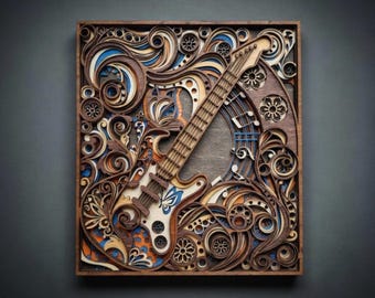 May include: A wooden, layered art piece featuring a guitar design. The guitar is light-colored with blue accents, set against a backdrop of swirling, layered patterns in shades of brown, orange, and blue. The artwork is framed in a dark wooden border.
