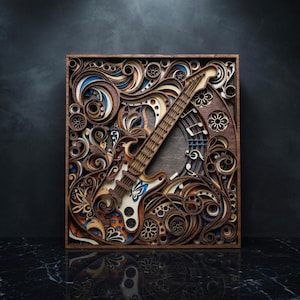 May include: A layered wooden art piece featuring an electric guitar design. The artwork incorporates intricate cut patterns, swirls, and floral motifs in shades of brown, blue, and white. The guitar is centered within a square frame.