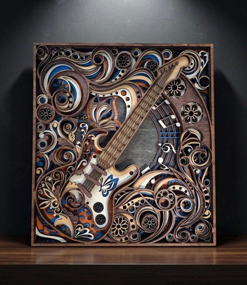 May include: A wooden wall art piece featuring a layered design of an electric guitar. The artwork incorporates swirling patterns in shades of brown, blue, orange, and white, with musical notes and floral accents. The guitar is white with blue accents.