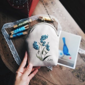 handmade cream colored bag with blue flowers