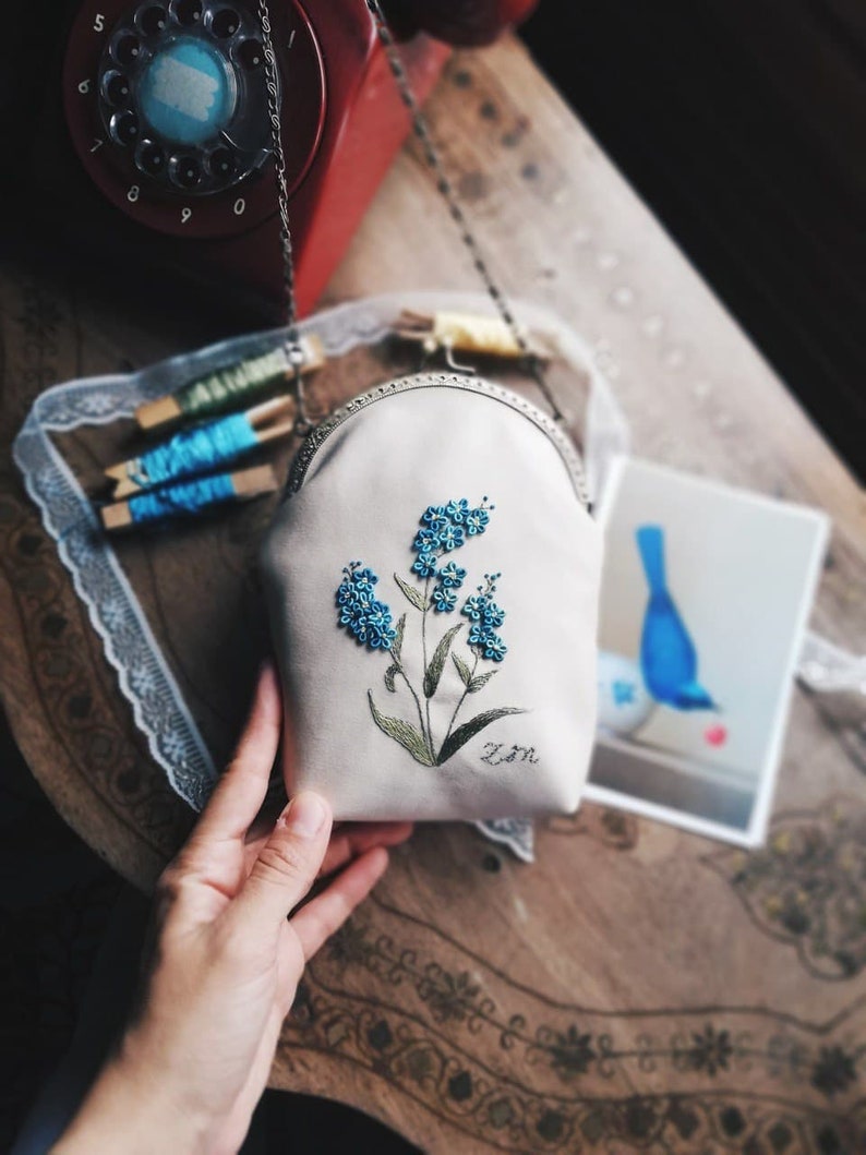 handmade cream colored bag with blue flowers