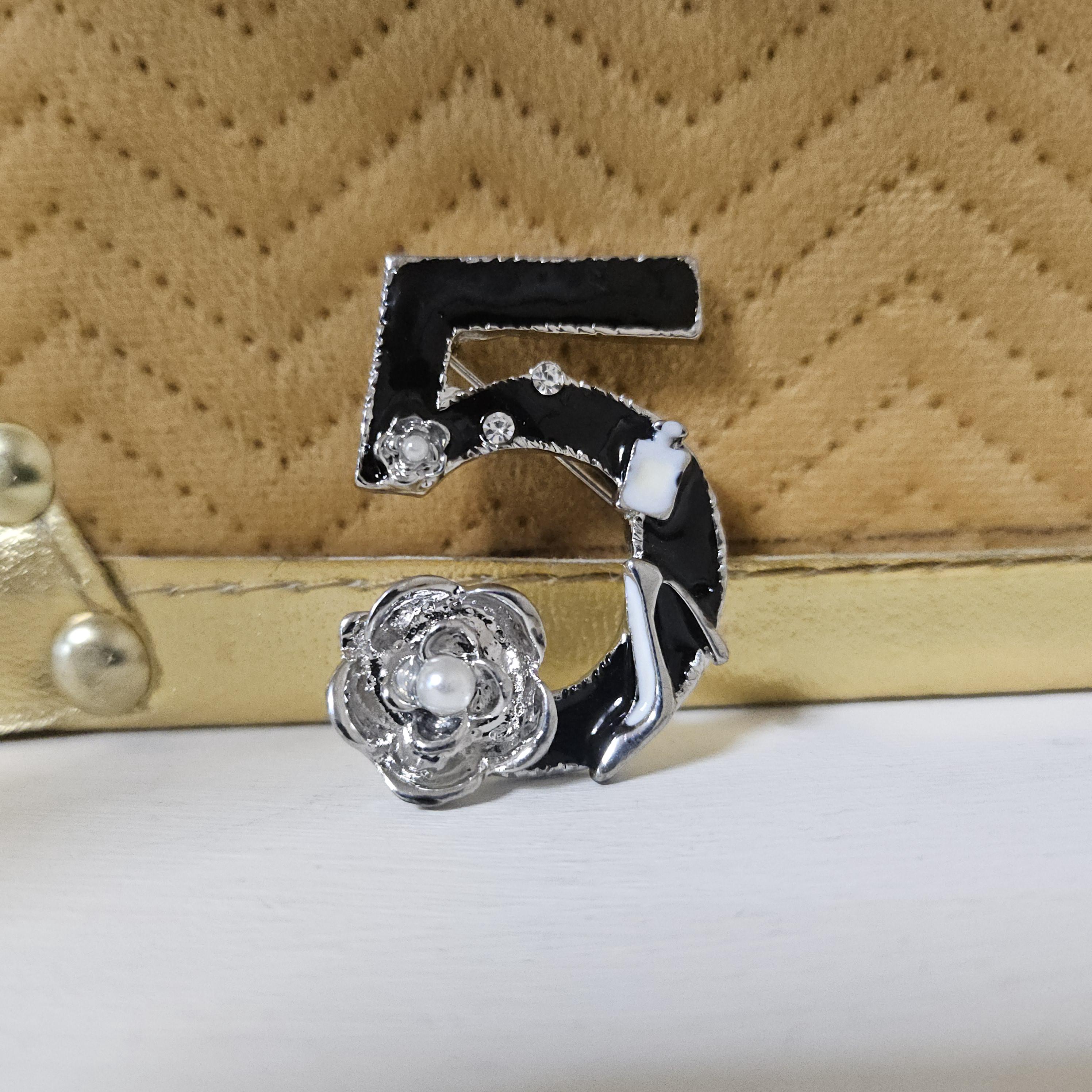 Chanel 5 brooch deals