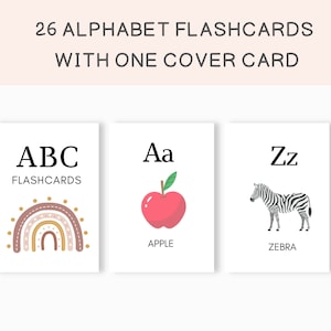 May include: A set of 26 alphabet flashcards with a cover card. The cover card features a rainbow with brown, pink, and gold accents. The first letter card shows the letter "A" and an apple. The last letter card shows the letter "Z" and a zebra.