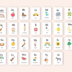 May include: A set of 26 alphabet flashcards with colorful illustrations. Each card features a letter of the alphabet, a corresponding word, and a picture representing the word. The cards are designed for children learning their ABCs.