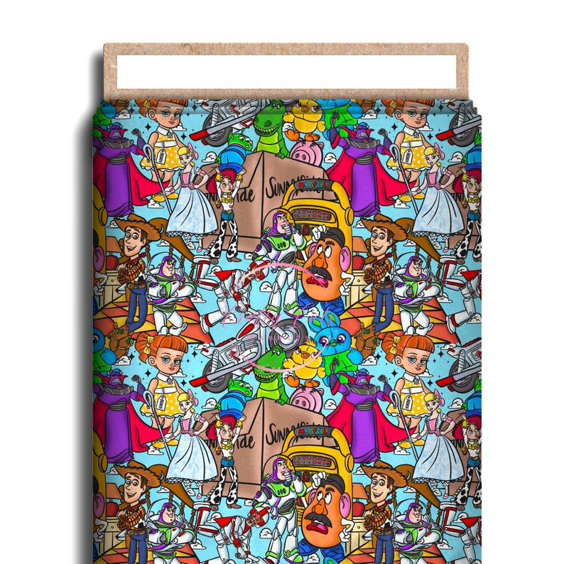 May include: A colorful fabric featuring a repeating pattern of Toy Story characters. The design includes Woody, Buzz Lightyear, Mr. Potato Head, and other characters on a light blue background. The fabric is likely used for crafting or home decor.