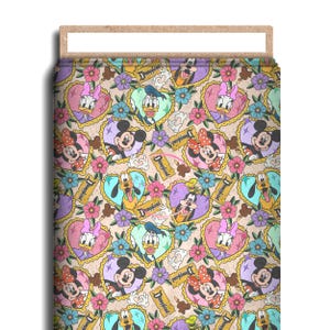 May include: A fabric bolt featuring a repeating pattern of Disney characters including Mickey Mouse, Minnie Mouse, Donald Duck, Daisy Duck, Pluto, and Goofy. Each character is framed by a heart, interspersed with flowers and Disneyland tickets.