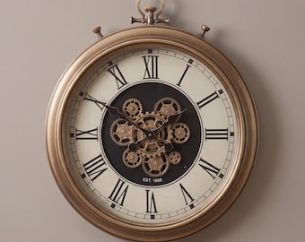 May include: A round wall clock with a metallic bronze frame and a cream-colored face featuring black Roman numerals. The center displays an exposed gear mechanism in bronze tones against a black background, with the text EST. 1898 printed below.
