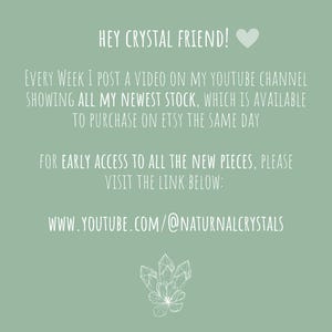 May include: Sage green background with white text. The text reads "HEY CRYSTAL FRIEND!" and provides information about new stock available on Etsy. Includes a YouTube link and a crystal graphic.
