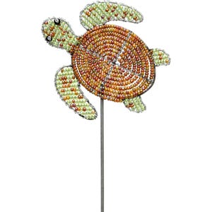 May include: A beaded sea turtle garden stake. The turtle's shell is a spiral of orange and brown beads, while the head and flippers are green. The turtle is mounted on a silver metal stake, perfect for adding a touch of whimsy to any garden.