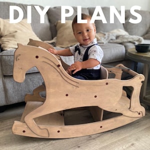 May include: A wooden rocking horse with a child seated in it. The horse is made of light-coloured wood and has a classic design. The text "DIY PLANS" is at the top of the image. The child is wearing a white shirt and dark blue overalls.