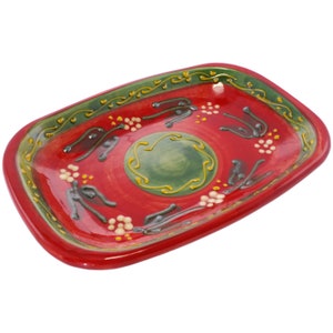 May include: A red rectangular ceramic serving dish with a green and yellow floral design. The dish has a glossy finish and is ideal for serving snacks or appetizers.