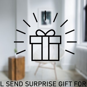 May include: A black and white illustration of a gift box with a bow on top. The gift box is surrounded by a burst of light rays. The text "I WILL SEND SURPRISE GIFT FOR YOU :)" is at the bottom of the image.