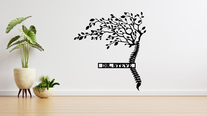 May include: Black silhouette of a tree with a spine for a trunk. The tree is growing out of a spine. The text "DR. STEVE" is on a rectangular sign below the tree.