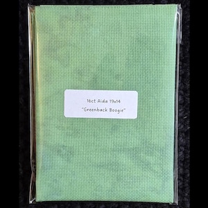 May include: Aida cloth in a clear plastic sleeve. The fabric is a light green colour. A white label on the front reads "16ct Aida 19x14" and "Greenback Boogie".