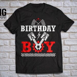 May include: Black t-shirt with a white graphic design featuring the text "Birthday Boy" with a checkered pattern, crossed checkered flags, and two pistons with a lightning bolt.