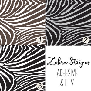 Könnte beinhalten: Drei verschiedene Zebrastreifenmuster in Braun, Grau und Schwarzweiß. Der Text "Zebra Stripes ADHESIVE & HTV" befindet sich unter den Mustern.