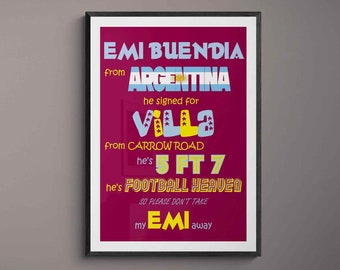May include: A framed poster with a burgundy background and white text. The poster features a graphic design with the text "EMI BUENDIA from ARGENTINA he signed for VILLA from CARROW ROAD he's 5 FT 7 he's FOOTBALL HEAVEN SO PLEASE DON'T TAKE my EMI away".