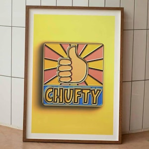 May include: Framed art print featuring a thumbs-up graphic with the word "CHUFTY" in a bold, colorful design. The artwork has a yellow background with a brown frame, suitable for wall decor.