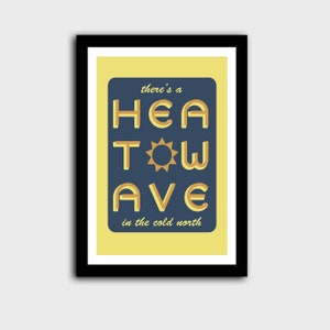 'Heatwave in the Cold North' print. Yellow/blue with the words 'there's a' & 'in the cold north' at the top/bottom, & 'HEATWAVE' in yellow/gold in the middle with a sunshine. On white background. Colour Combo 2