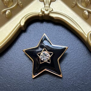 Vintage Signed Trifari TM Black Enamel Star Brooch Pin