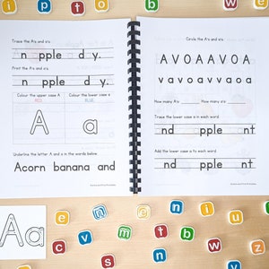 May include: A black and white workbook with the letter A in uppercase and lowercase. The workbook has activities for tracing, printing, coloring, and circling the letter A. The words "apple", "day", "acorn", "banana", and "and" are included in the workbook.