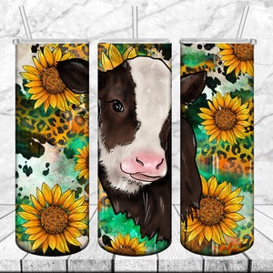 May include: A stainless steel tumbler with a design featuring a brown and white calf, sunflowers, and a leopard print pattern.