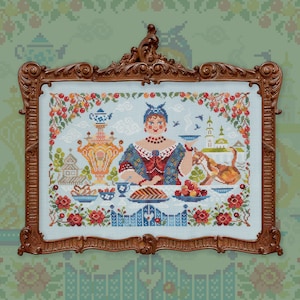 May include: A cross-stitch embroidery framed in a brown wooden frame. The embroidery depicts a woman in a blue and red dress sitting at a table with a samovar, teacups, and a cat. The background is a light blue sky with white clouds and red flowers.