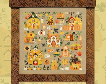 May include: A framed cross-stitch embroidery featuring a whimsical autumn scene with pumpkin houses, birds, and other fall-themed elements. The embroidery is set against a beige background and framed in a dark brown wood frame with intricate carvings.
