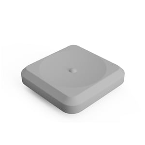 May include: A light gray square object with rounded corners and a beveled edge. The top surface features a circular recessed area with a small, centered, raised dome-shaped protrusion. The object has a smooth, matte finish and a uniform color.