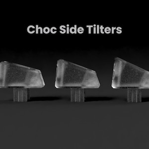 May include: Three clear plastic keyboard keycaps with a tilted design, labeled "Choc Side Tilters".