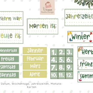 May include: A set of green and yellow cards with German words for days of the week, months of the year, and seasons. The cards are decorated with illustrations of flowers, leaves, and snowflakes.