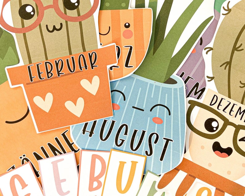 May include: A set of colourful monthly calendar cards featuring cute cactus illustrations with different facial expressions. Each card has the month's name written in a playful font. The months included are February, August, December, January, and June.