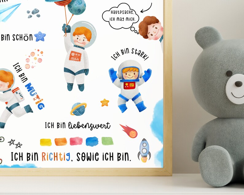May include: A watercolor illustration of an astronaut with a blue and white spacesuit. The astronaut is holding a blue balloon with stars. The illustration includes the text "Ich bin sch&ouml;n", "Ich bin mutig", "Ich bin stark", "Ich bin liebenswert", and "Ich bin richtig, sowie ich bin".