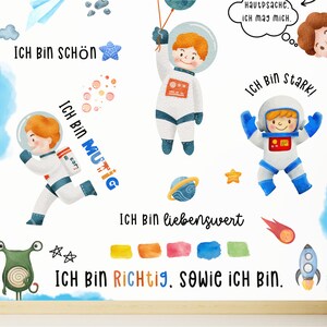 May include: A watercolor illustration of an astronaut with the text "ICH BIN SCH&Ouml;N", "ICH BIN MUTIG", "ICH BIN STARK", "ICH BIN LIEBENSWERT", and "ICH BIN RICHTIG, sowie ich bin." The illustration is surrounded by stars, planets, and a rocket.