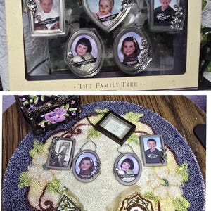 May include: A Hallmark Keepsake The Family Tree ornament set featuring five silver-toned metal frames in rectangular, heart, and oval shapes with floral accents. The set includes various portrait photos and hanging chains for display on a tree.