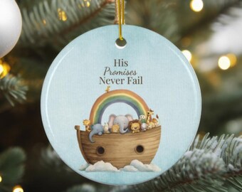 May include: Round Christmas ornament with a light blue background and a gold string. The ornament features a depiction of Noah's Ark with animals, a rainbow, and the text "His Promises Never Fail".