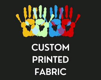 May include: Four colorful handprints in yellow, light blue, blue, and red, overlapping each other. The text below reads "CUSTOM PRINTED FABRIC" and "We print your own designs".