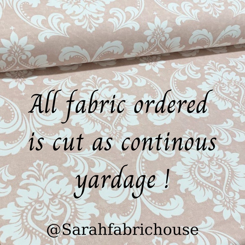 May include: A close-up of a pink fabric with a white damask pattern. The text "All fabric ordered is cut as continuous yardage! @Sarahfabrichouse" is printed on the fabric.