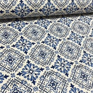 May include: Blue and white patterned fabric with a repeating tile design. The fabric has a linen texture.