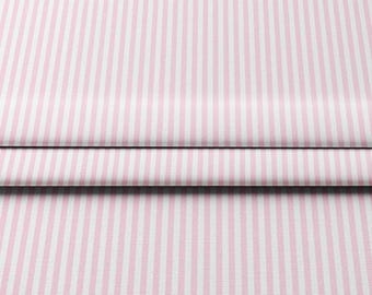 May include: Pink and white striped fabric with vertical stripes. The fabric is folded over, creating a layered effect. The stripes are evenly spaced and run the length of the fabric.