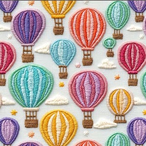 May include: Embroidered fabric featuring a repeating pattern of colorful hot air balloons. The balloons are in shades of pink, purple, orange, yellow, and blue, with brown baskets and white cloud accents. The design is on a white background.