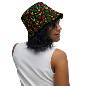 May include: A black bucket hat with a green, red, and yellow marijuana leaf pattern.