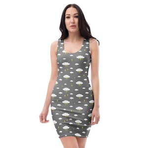 May include: A gray bodycon dress featuring a repeating pattern of white clouds and yellow lightning bolts. The sleeveless dress has a scoop neckline and is form-fitting.